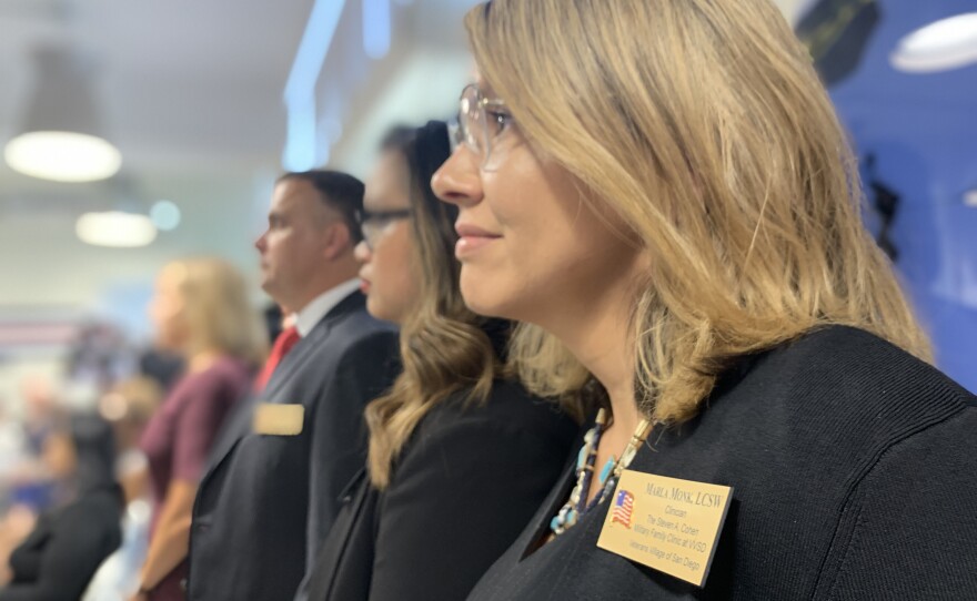License clinical social worker Marla Monk stands next to co-workers at a grand opening event for the Steven A. Cohen Military Family Clinic at Veterans Village of San Diego, Sept. 5, 2019.