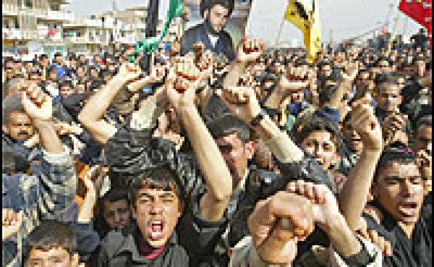 Angry Iraqi Shiites demonstrate in Baghdad's poor neighborhood of Sadr City to protest against the bombing of the holy shrine in the Iraqi northern city of Samarra.