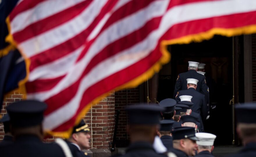 Members of the New York City Fire Department honor firefighter Thomas Phelan at his funeral in Brooklyn March 20, 2018. Phelan worked as a Statue of Liberty ferry boat captain, helping to evacuate thousands of stranded citizens from Lower Manhattan during the 9/11 attacks and died of cancer believed to be related to his exposure to the toxic fumes around ground zero.