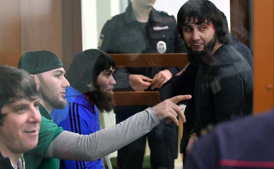Zaur Dadayev (right) was convicted of carrying out the assassination of politician Boris Nemtsov in February 2015. He's seen here in court last month, inside a defendants' cage during a hearing at the Moscow District Military Court.