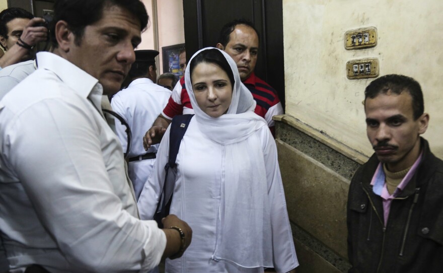 Aya Hijazi (center), a dual U.S.-Egyptian citizen, was acquitted by an Egyptian court on Sunday after nearly three years of detention over accusations related to the foundation she and her husband ran, dedicated to helping street children in Cairo.