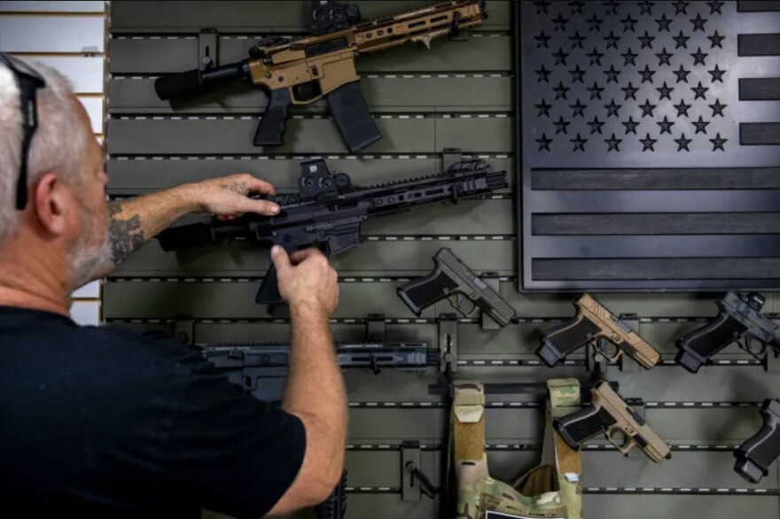 Gunsmith Don Gregory shows off two new single-action firearms recently released by Juggernaut Tactical in Orange on Thursday, Sept. 21, 2023.