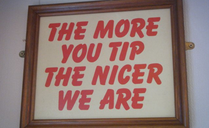 A sign reads "The more you tip the nicer we are."