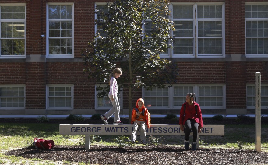 On the outside, little has changed at George Watts Elementary School over the years — except for the sign, which hints at the radical changes that have happened inside.