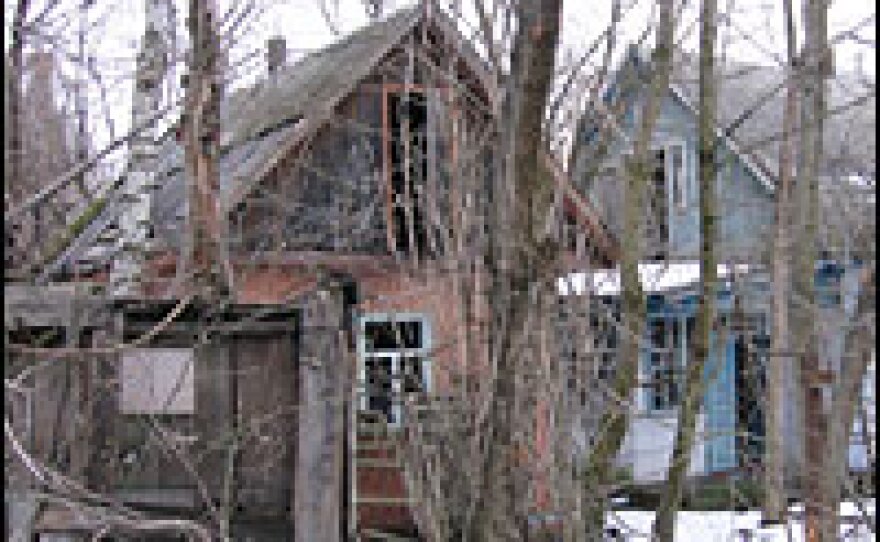 Empty village houses inside the ghost town of Chernobyl's exclusion zone.