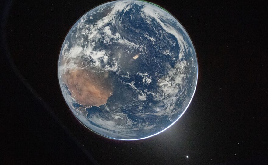 April 2: A view of Earth taken by Wiseman from of the Orion spacecraft's window after completing the translunar injection burn.