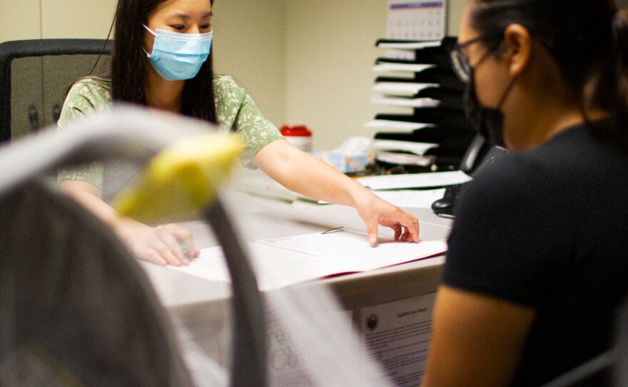 Yang meets with a patient who has come to the public health department for a penicillin shot.