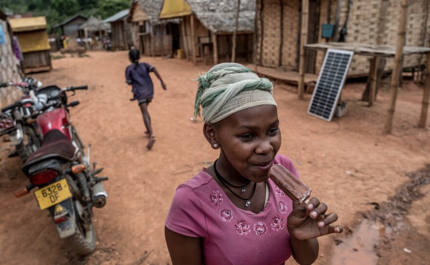 A girl eats chocolate ice cream in Belambo village, Madagascar. Even though the village is at the heart of the country's vanilla-growing region, vanilla is not a common flavoring here.