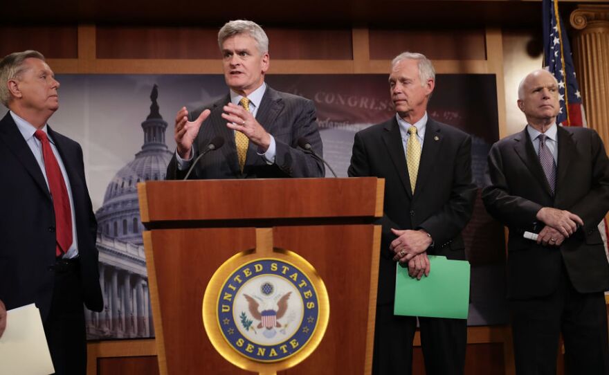 Sen. Lindsey Graham (from left), Sen. Bill Cassidy, Sen. Ron Johnson and Sen. John McCain, all Republicans, announced Thursday that they would not vote for a so-called skinny repeal of the Affordable Care Act without assurances from the House that the bill would go to conference.