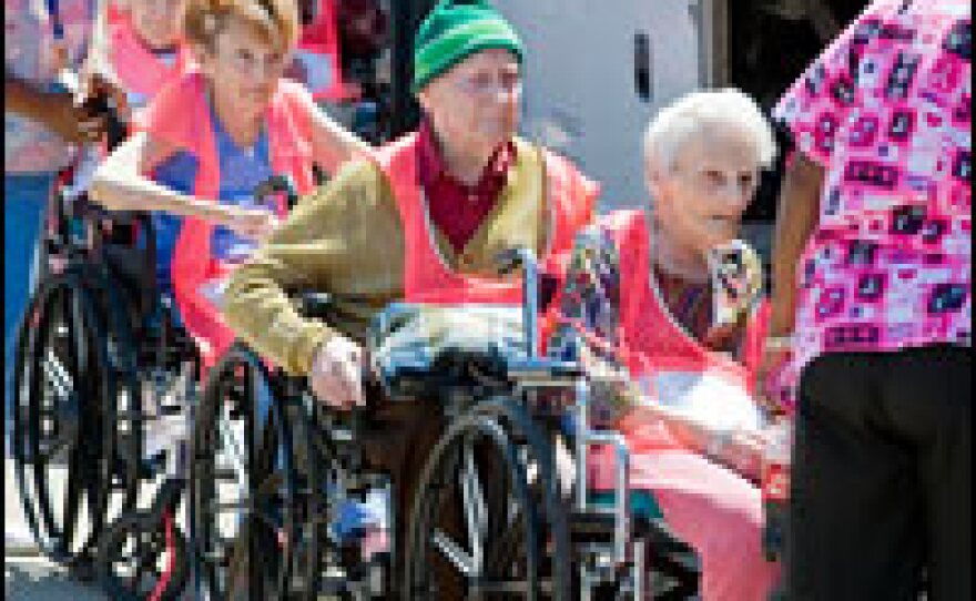 Residents of a retirement home in Galveston, Texas, line up to board an evacuation bus in advance of Hurricane Ike, Sept. 11, 2008.