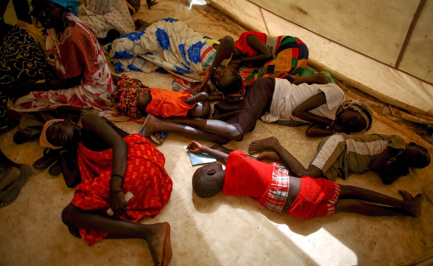 Sick children wait to be seen at the Doctors Without Borders clinic in Bentiu. Many children in the camp suffer from malaria and malnutrition.