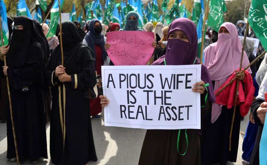 As women gathered to call for equal rights in Islamabad, conservative women demonstrated against the protesters.