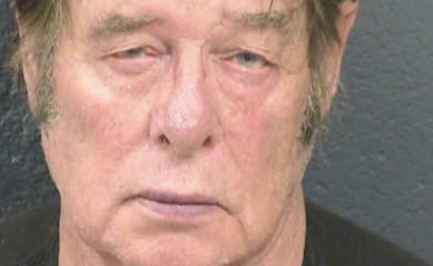 Larry Mitchell Hopkins appears in a police booking photo taken in Las Cruces, N.M., on April 20. Hopkins made his initial court appearance Monday, on charges of possession of firearms by a felon.