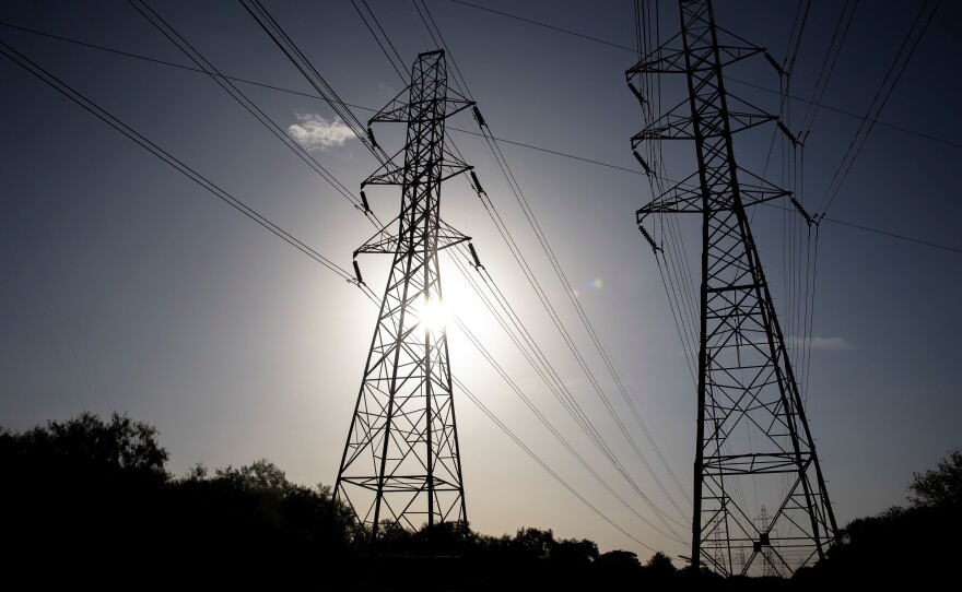 Power transmission lines span toward San Antonio, Texas. More than 100 million people are currently under heat-related warnings and advisories across the United States, the National Weather Service Weather Prediction Center said Tuesday.