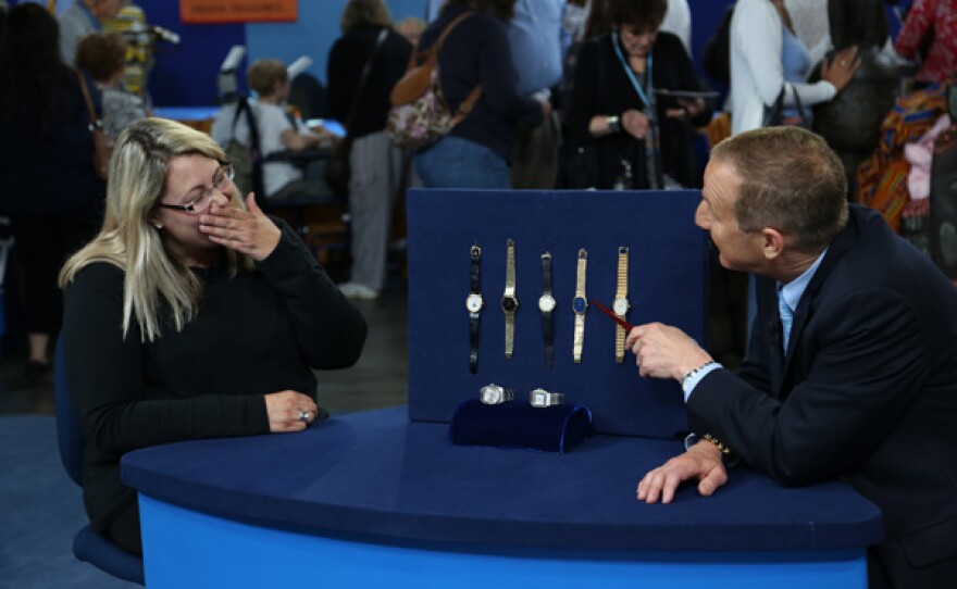 Paul Winicki (right) appraises a Swiss watch collection, ca. 1970, for $46,000 to $57,000 in Detroit, Michigan.