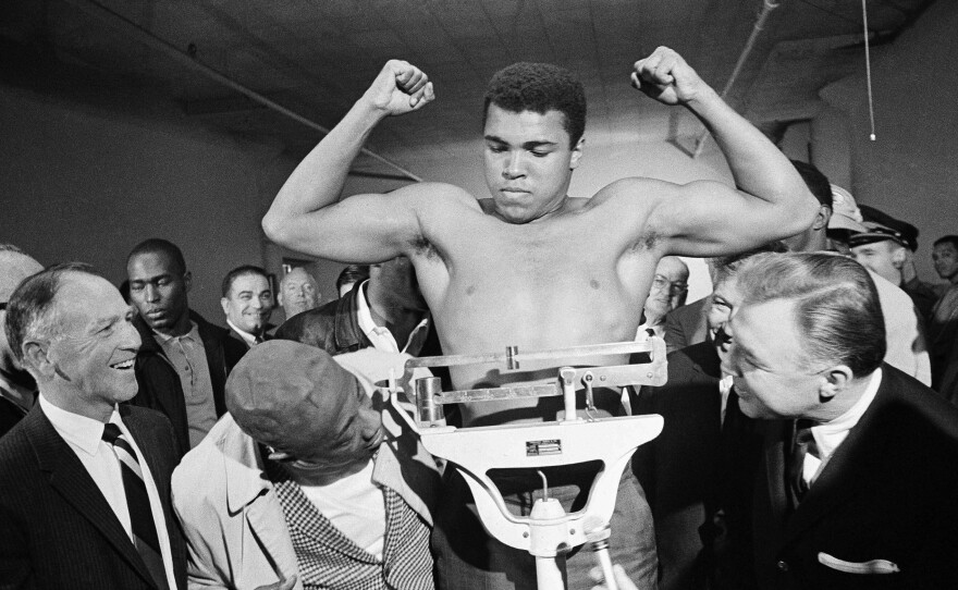 Boxer Muhammad Ali weighs in before his heavyweight bout with Jerry Quarry on Oct. 20, 1970, in Atlanta.