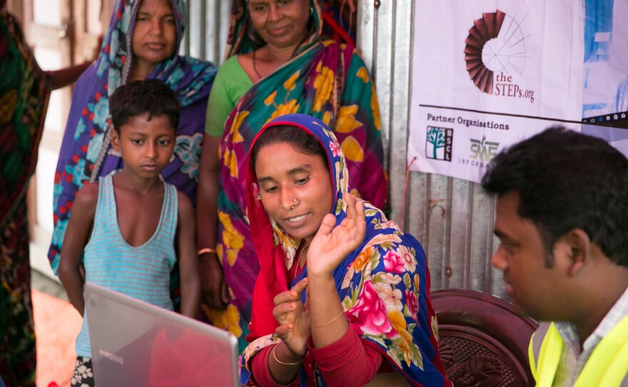 A patient consults with a doctor during a Teledaktar session on a char near Rangpur, Bangladesh. The visit is an opportunity for the patients, especially women, to air their concerns about aging, motherhood and reproductive health.