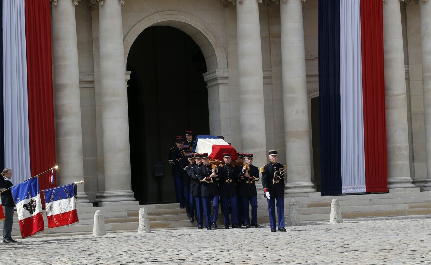 Republican guards carry the flag-draped coffin of Simone Veil during a funeral ceremony in Paris on Wednesday.