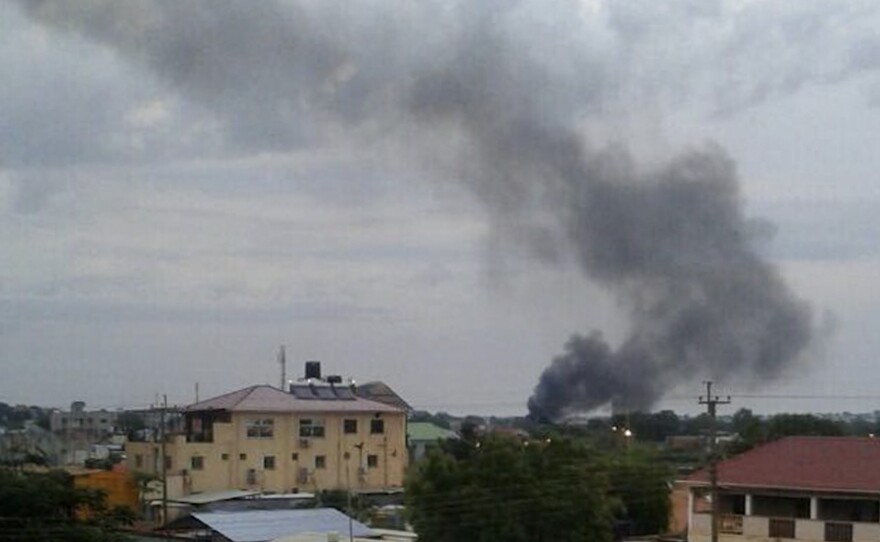 Black smoke rises above Juba, the capital of South Sudan, on Sunday. Explosions and heavy weapons gunfire are shaking Juba Monday in the fifth day of clashes between government and opposition forces, raising the specter of a return to civil war.