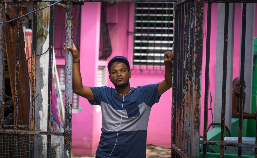 Pedro Galindez Casillas looks at a destroyed house in the Playita neighborhood. Just five percent of the island has working electricity from the hurricane-devastated grid.