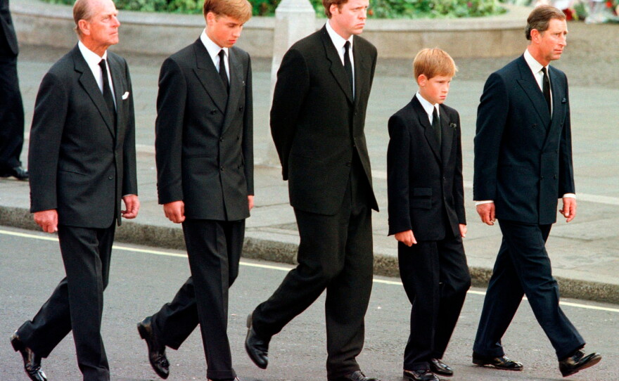 FILE - From left: Britain's Prince Philip, Prince William, Earl Spencer, Prince Harry and Prince Charles walk outside Westminster Abbey during the funeral procession for Diana, Princess of Wales, Sept. 6, 1997.