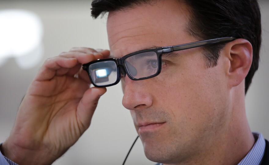 Chris Barnes tries out Toshiba Glass, one of a number of new wearable gadgets at the 2015 Consumer Electronics Show in Las Vegas.