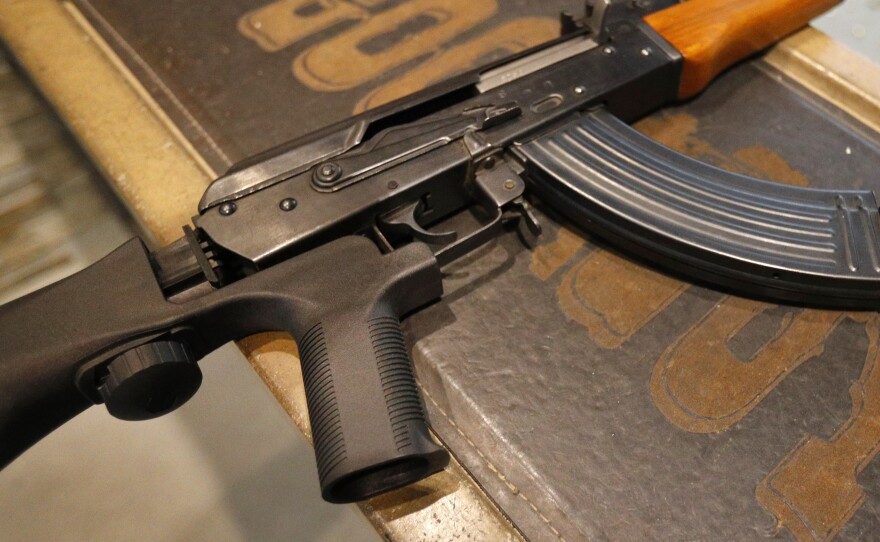 Bump stocks like this one installed on an AK-47 are now illegal in the U.S., after the Trump administration changed how they are legally defined.  The devices can allow a semi-automatic rifle to fire nearly as fast as a machine gun.