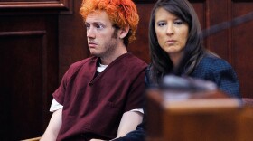 Accused movie theater shooter James Holmes (L) makes his first court appearance at the Arapahoe County Courthouse with his public defender Tamara Brady on July 23, 2012 in Centennial, Colorado. 