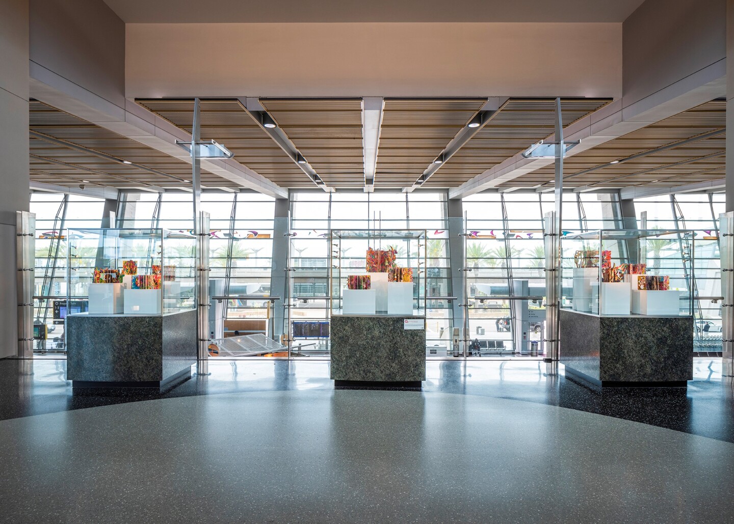 Brightly colored books, "When Doodles Dare to Dream," by San Diego artist Rosemary Rae, are shown installed in an undated photo at the San Diego airport's Terminal 2, in the area just before the stairs to baggage claim.