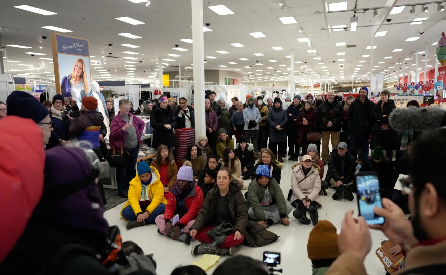 Community members and neighbors of people detained by ICE gather in protest at a Target store on Jan. 19, 2026 in St. Paul, Minn.