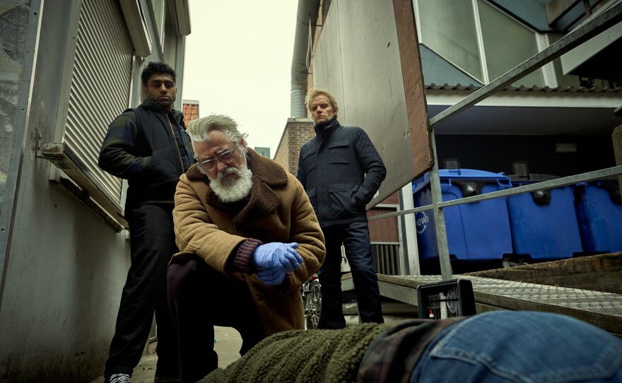 Eddie Suleman (Azan Ahmed), Hendrik Davie (Darrell D'Silva), Piet Van der Valk (Marc Warren) in VAN DER VALK Season 4 On MASTERPIECE