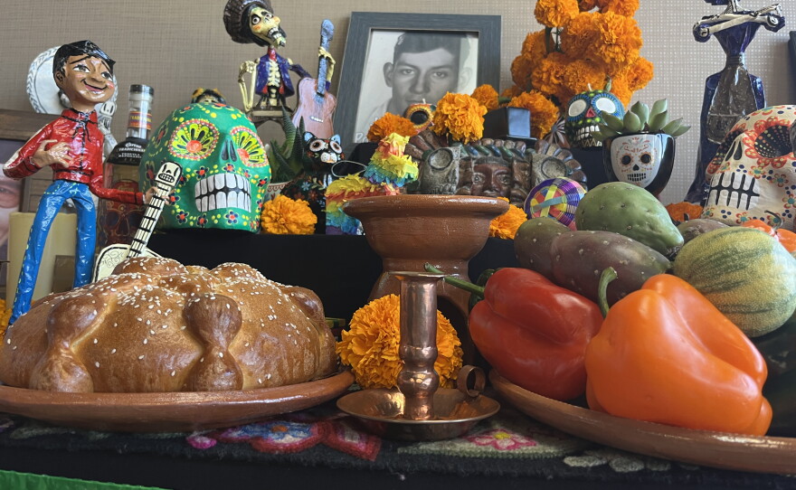 An altar with marigolds, food and other offerings sits inside of La Vista Memorial Park's office, Oct. 26, 2026.