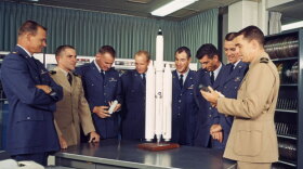 Pictured (l-r): Al Crews, Richard Truly, Richard E. Lawyer, James M. Taylor, Francis G. Neubeck, Michal J. Adams, Lachlan Macleay and John L. Finley. After being selected for the Manned Orbiting Laboratory (MOL) program, MOL's first crew prepares for their intensive training program. 