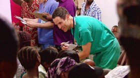 A team of volunteer doctors and nurses speak with a room full of patients. "The Adventists 2" explores the global story of this American-born strand of Christianity known as Seventh-day Adventism, including the church's medical mission work internationally and their more than century-old commitment to provide health and healing in some of the most remote regions in the world.