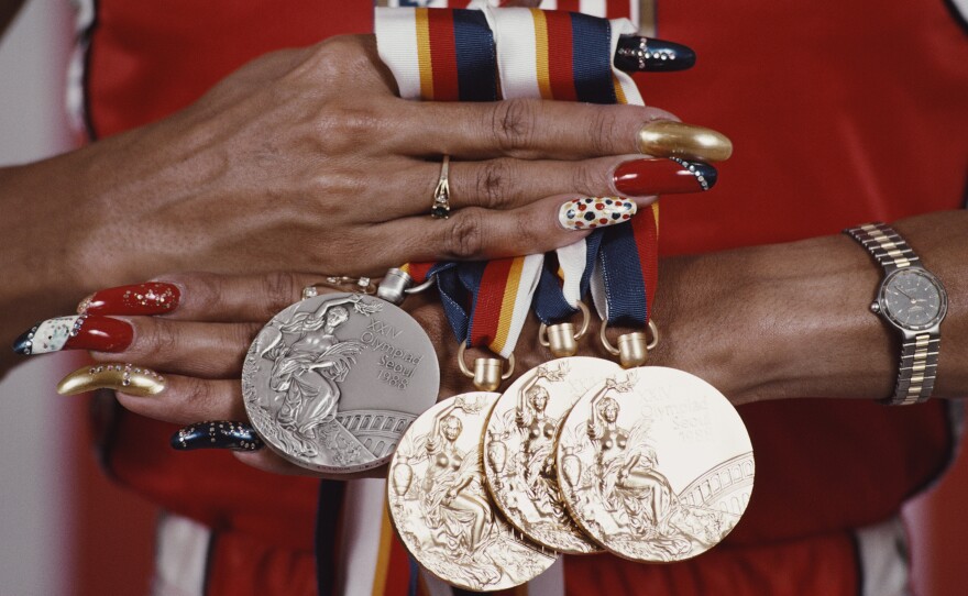Griffith Joyner displays her medals from the 1988 Summer Olympic Games. She won gold in the Women's 100, 200 and 4x100 meters relay and silver for the 200 meters.