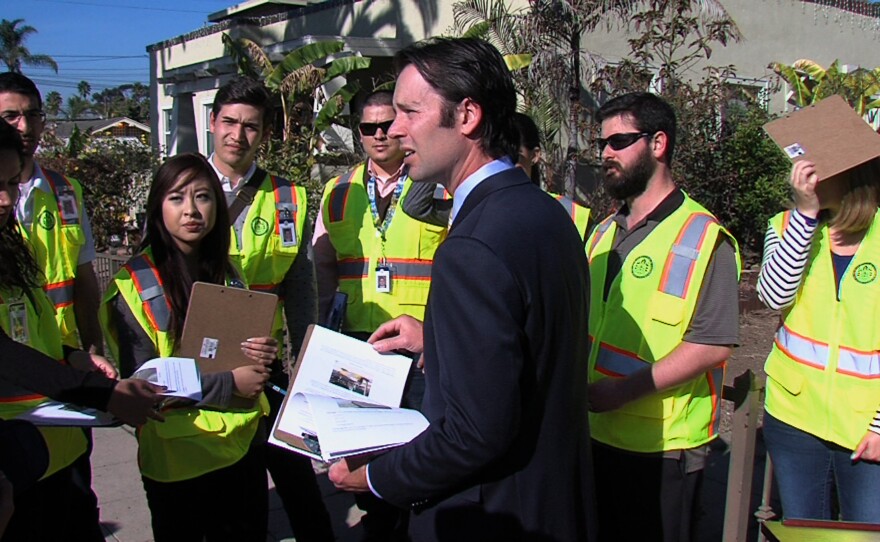 San Diego City Councilman Mark Kersey talks to a group of engineering students conducting an assessment of all of the city's sidewalks. January 10, 2014.