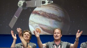 Scott Bolton, left, and Rick Nybakken are seen in a post-orbit insertion briefing at NASA's Jet Propulsion Laboratory in Pasadena following the solar-powered Juno spacecraft entered orbit around Jupiter, July 4, 2016.