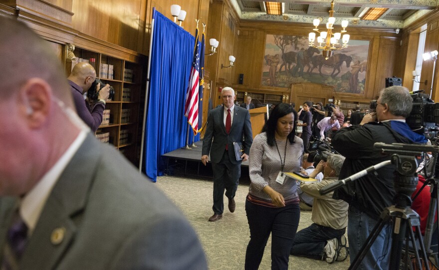 Pence leaves a press conference at the Indiana State Library in Indianapolis in 2015, where he spoke about the state's controversial Religious Freedom Restoration Act.