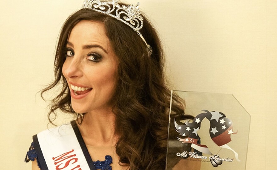 Rachel Engler holds her trophy from the Ms. Veteran America competition.