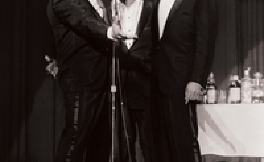 Frank Sinatra performing with Dean Martin and Sammy Davis Jr.