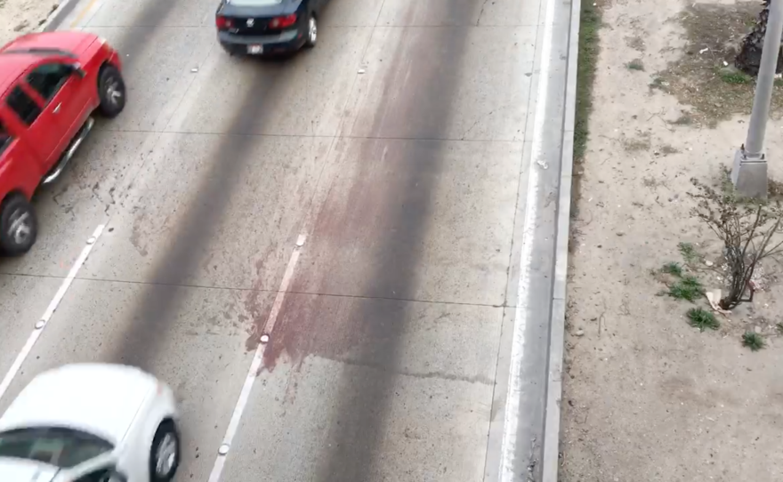 The Vía Rápida highway in Tijuana is stained with blood after a migrant was killed in a car collision, Jan. 18, 2016.