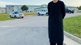 Feraidon Hakimi, wearing Afghan clothes, stands outside Fort Pickett military base in Blackstone, Va. in October 2021. Hakimi spent four months on the base before moving to Maryland.