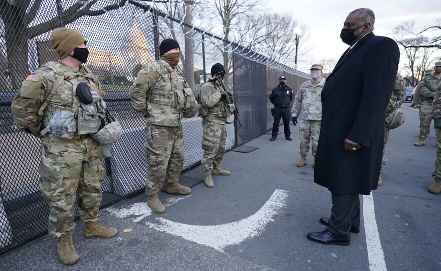 Defense Secretary Lloyd Austin visits National Guard troops deployed at the U.S. Capitol on Jan. 29. The troops were deployed in the wake of the Jan. 6 Capitol attack. Under Austin's order, all military units are holding "stand downs" to discuss extremism in the ranks.