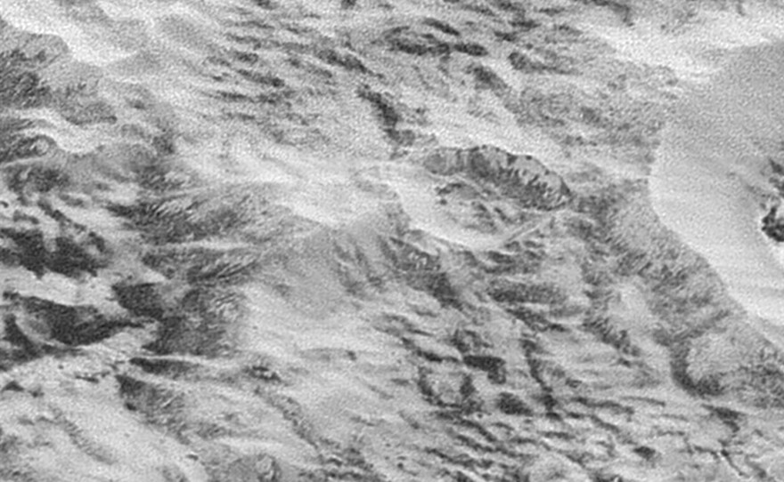 The highest-resolution images to come from New Horizons shows what NASA calls Pluto's "Badlands," an area that shows show how erosion and faulting have sculpted the icy crust into a rugged topography.