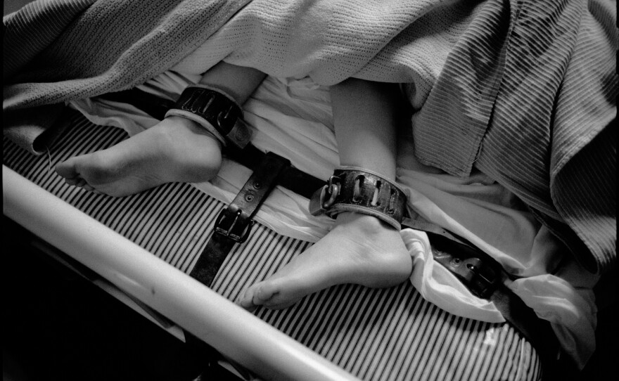 Feet in restraints, Ward 81, Oregon State Hospital. Salem, Oregon, 1976.