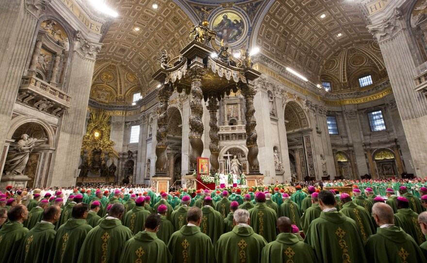 Bishops and cardinals pray as Pope Francis celebrates the opening Mass of the Synod of Bishops, in St. Peter's Basilica at the Vatican on Sunday.