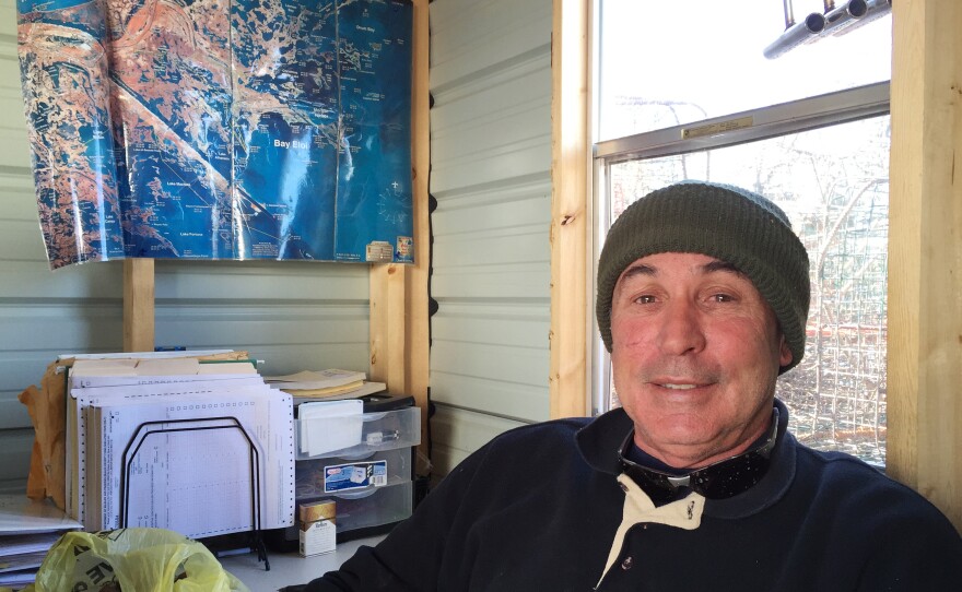 Tony Goutierrez sits inside his office (a trailer on his dock) in Hopedale, La. He says he's having a hard time meeting the demand for Gulf crabs from his longtime customers.