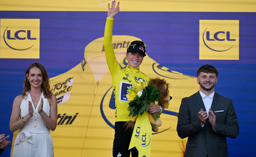 Netherlands' Demi Vollering celebrates on the podium after winning the Women's Tour de France cycling race in Nice, France, Sunday, Aug. 9, 2026.