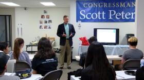 Democratic Congressman Scott Peters talks to student volunteers at his San Diego campaign headquarters, April 22, 2016.