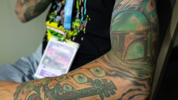A Star Wars-themed tattoo sleeve featuring Boba Fett is flexed at Comic-Con, July 24, 2026.